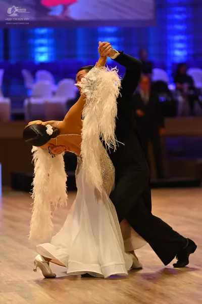 Dancesport competitor: Male dancer: black suit