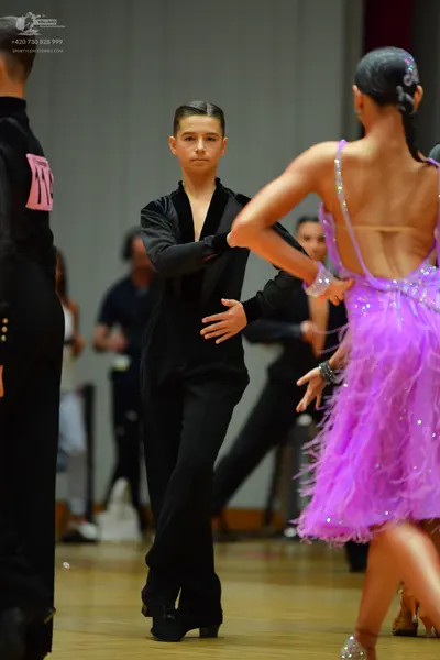 Dancesport competitor #111: Male dancer: black suit with velvet collar