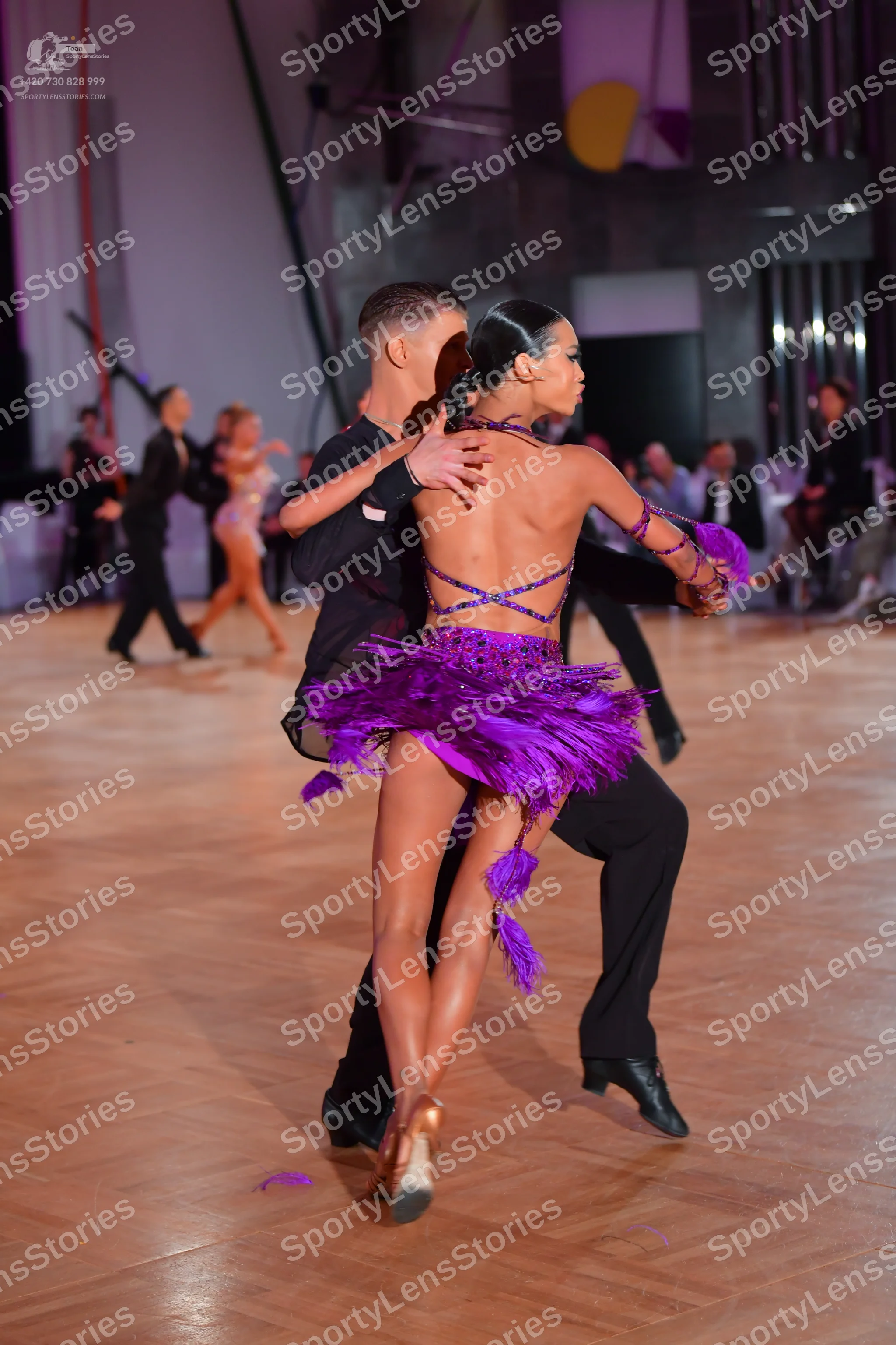 Dancesport competitor: Main male dancer: black long-sleeved latin dance top and trousers