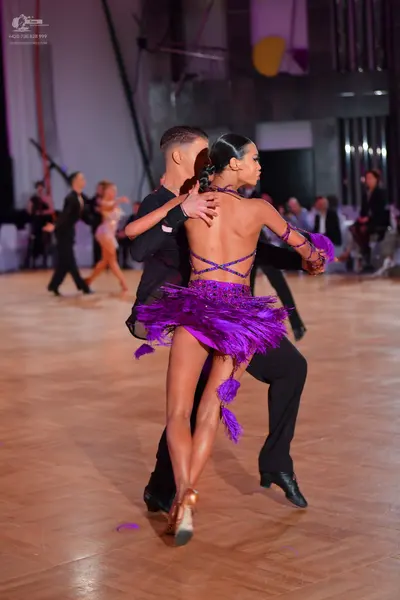 Dancesport competitor: Main male dancer: black long-sleeved latin dance top and trousers
