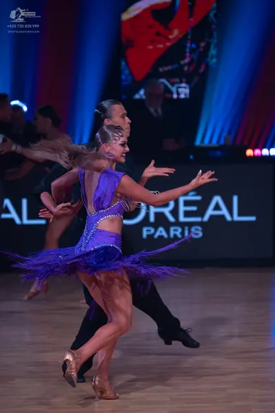 Dancesport competitor: Male dancer: black shirt and black trousers