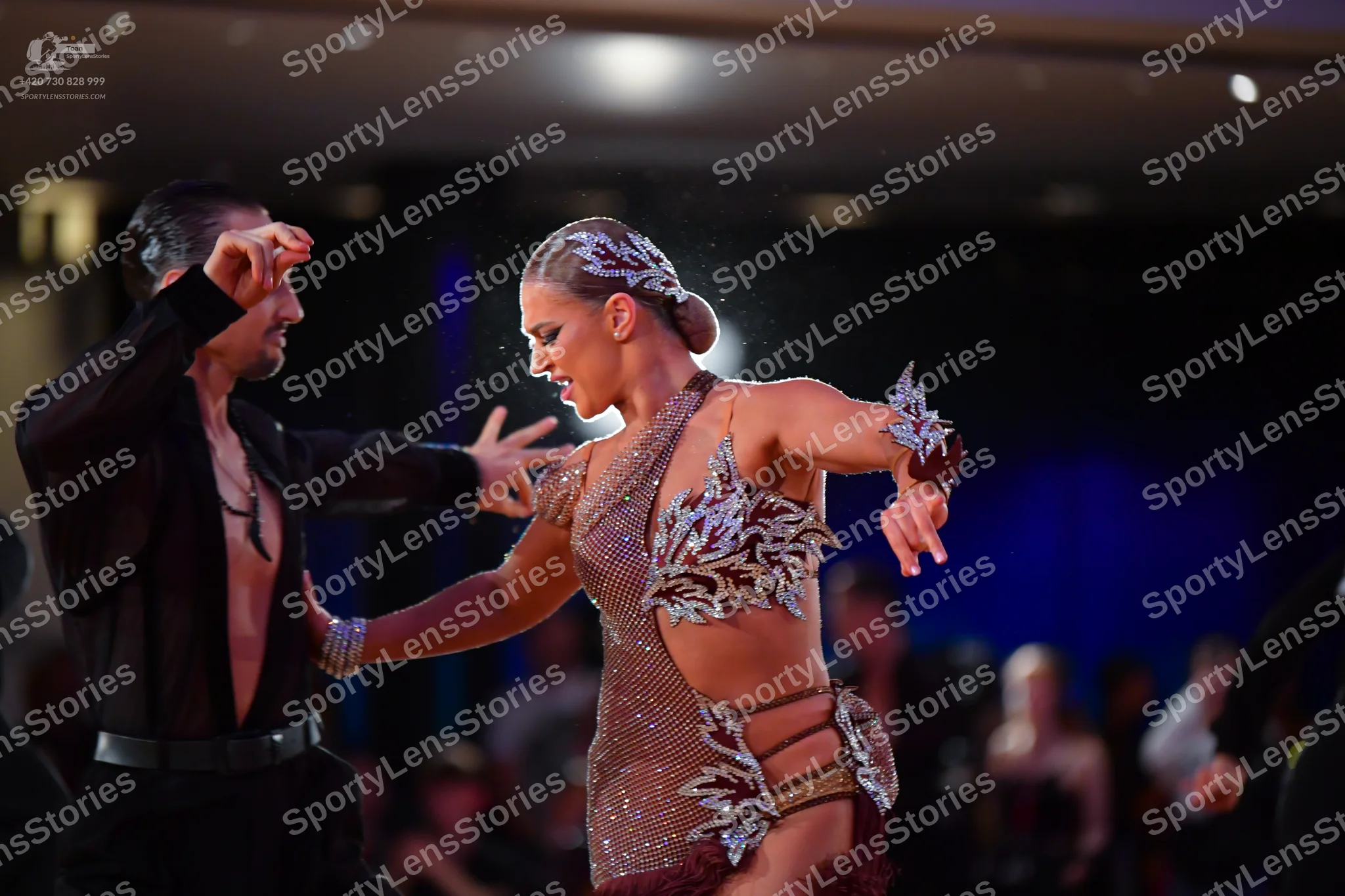 Dancesport competitor: Male dancer: black long-sleeved dance shirt, open at the chest, with a dark pend