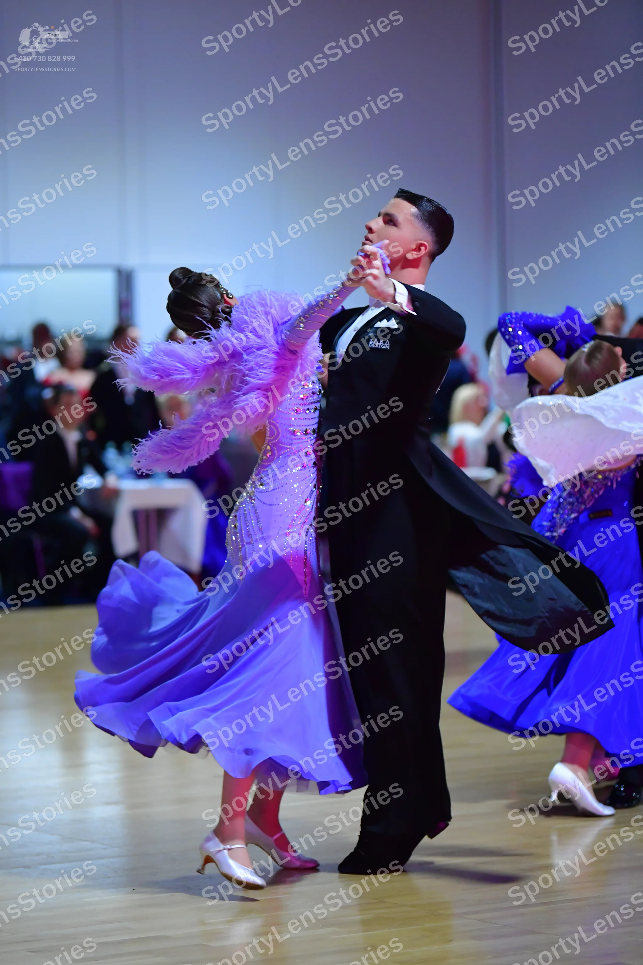 Dancesport competitor: Male dancer: black tailcoat, white shirt, and black trousers