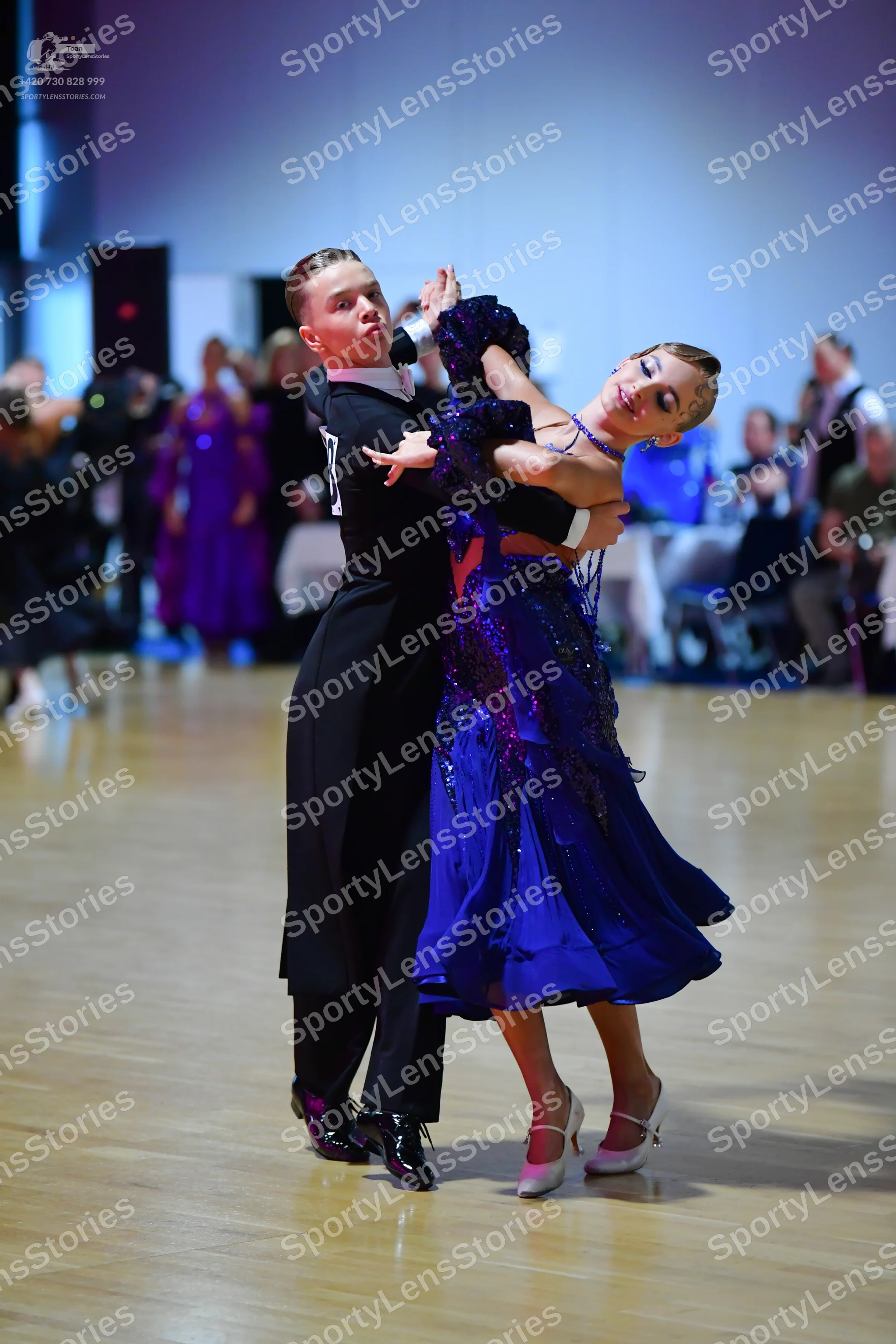 Dancesport competitor: Male dancer: black long-sleeved top and black trousers
