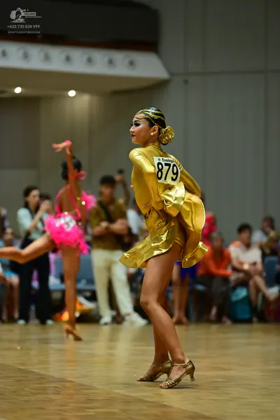 Dancesport competitor #879: Female dancer 1: gold metallic Latin dress