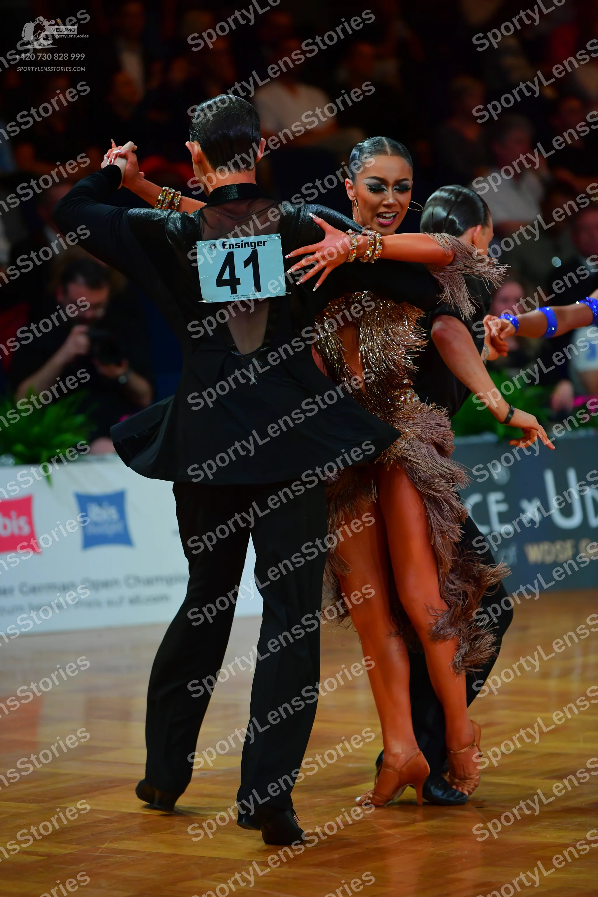 Dancesport competitor #41: Male dancer: black suit with an open back design