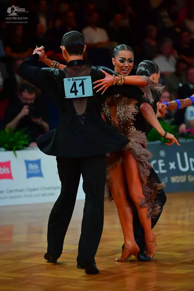 Dancesport competitor #41: Male dancer: black suit with an open back design