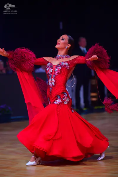 Dancesport competitor: Male dancer: black suit with a white shirt