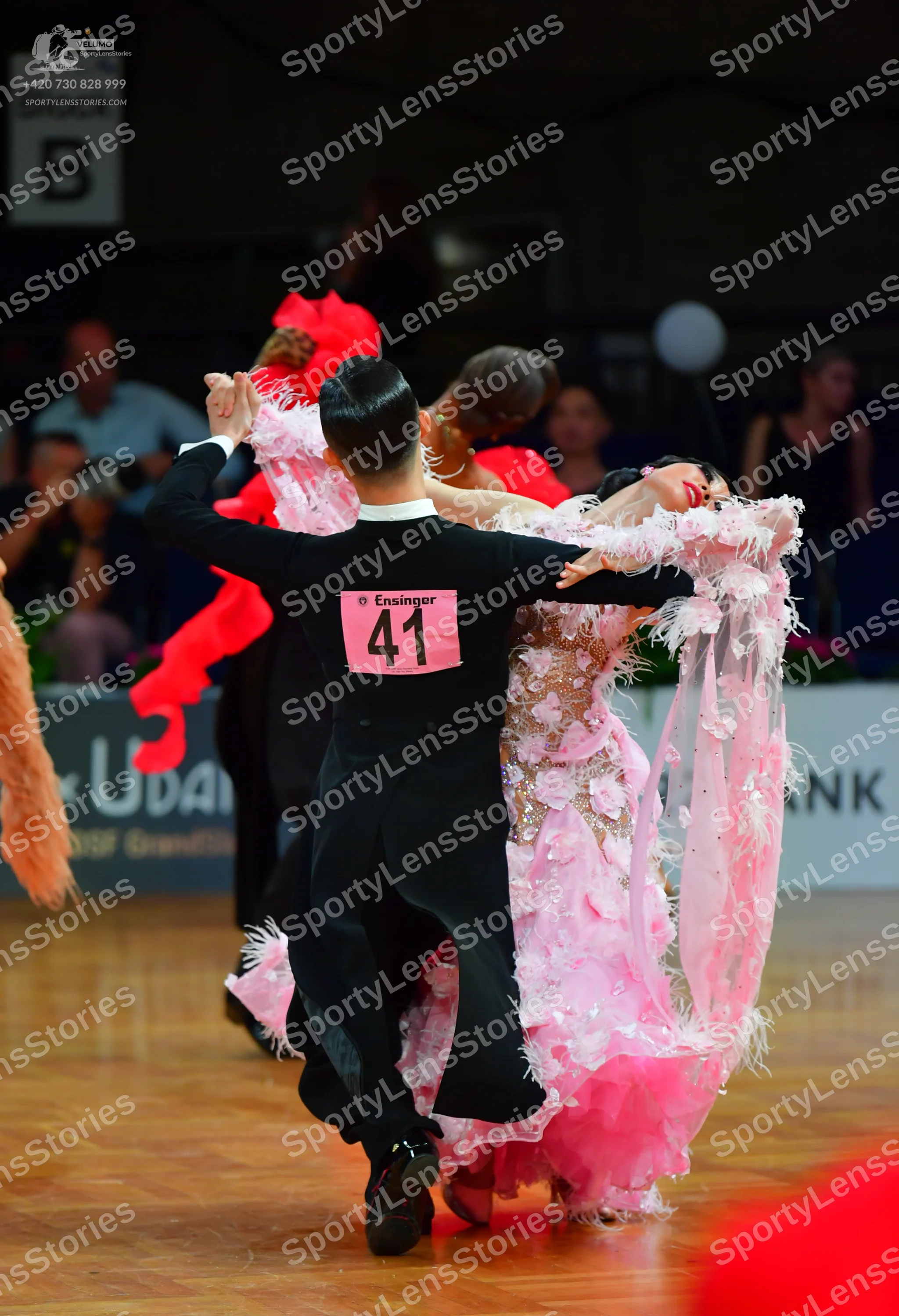Dancesport competitor: Male dancer: black long-sleeved suit and black trousers