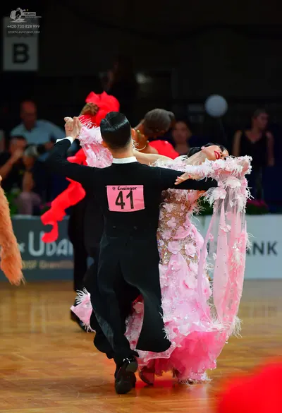 Dancesport competitor: Male dancer: black long-sleeved suit and black trousers
