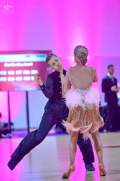 Dancesport competitor: Male dancer: black long-sleeved top and black trousers