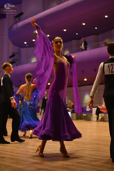 Dancesport competitor: Male dancer (left): black suit