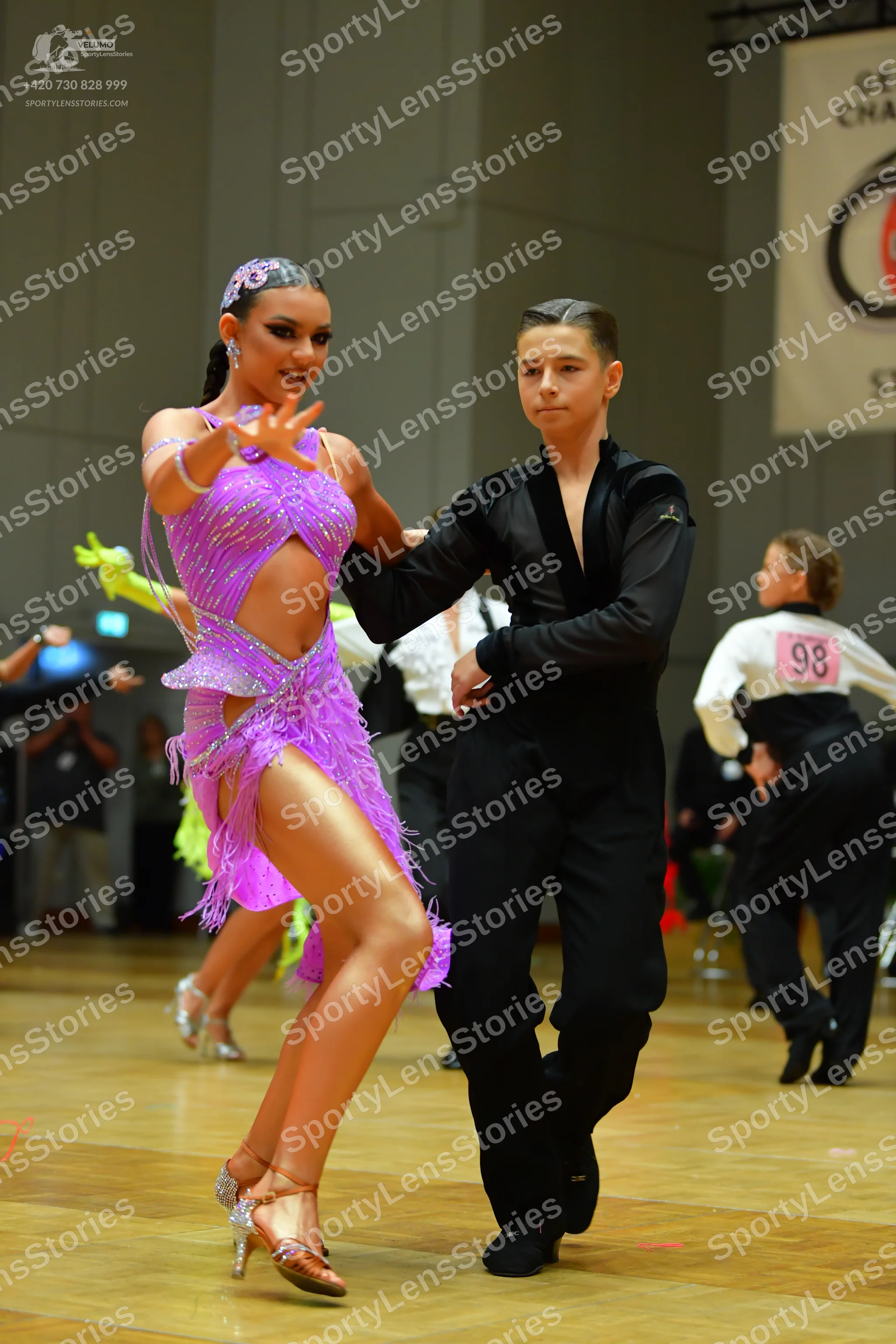 Dancesport competitor #98: Female dancer: purple latin dress with sequins and fringe