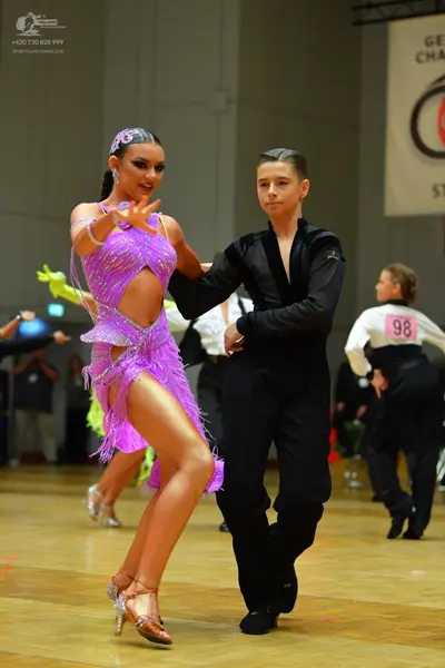 Dancesport competitor #98: Female dancer: purple latin dress with sequins and fringe