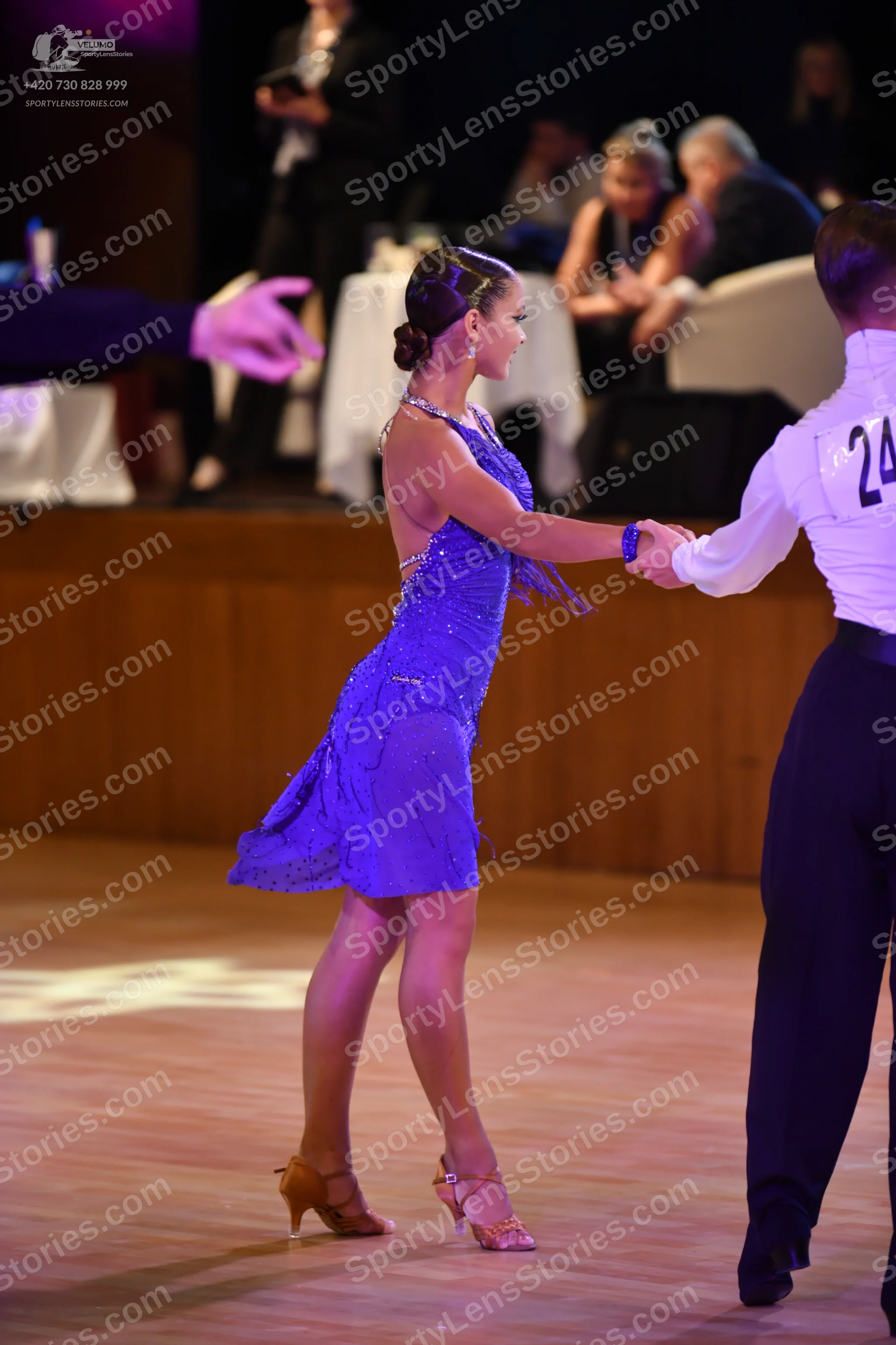 Dancesport competitor: **  A shimmering, deep blue latin dress