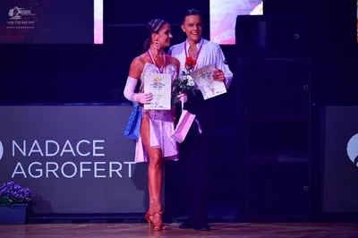 Dancesport competitor: Male dancer: white long-sleeved shirt and black trousers