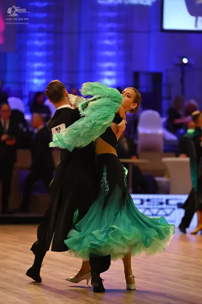 Dancesport competitor: Male dancer: black ballroom tailcoat
