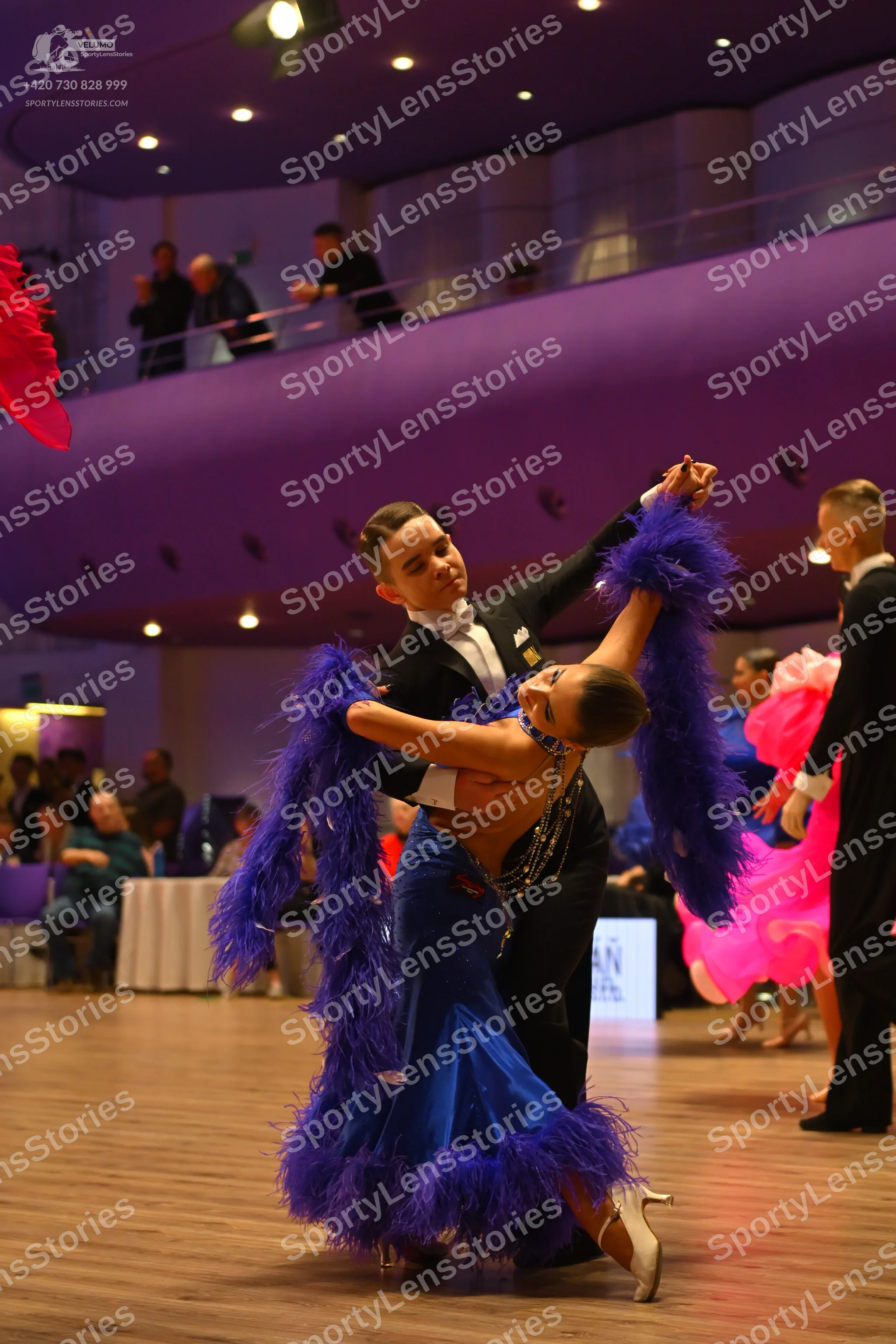 Dancesport competitor: Male dancer: black suit with a white shirt