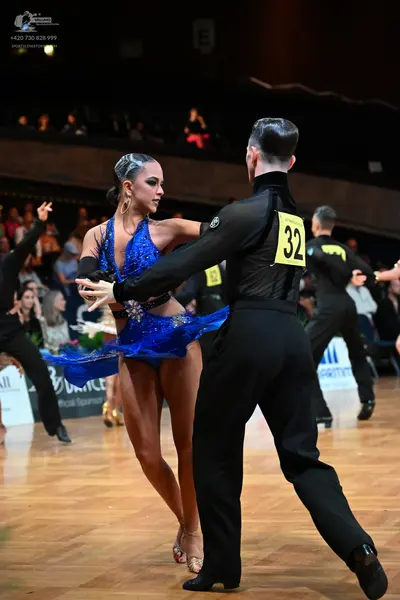 Dancesport competitor #32: Female dancer: blue sequin Latin dress