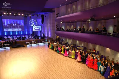 Dancesport competitor: Female dancers: A variety of brightly colored Latin dresses in shades of green, 