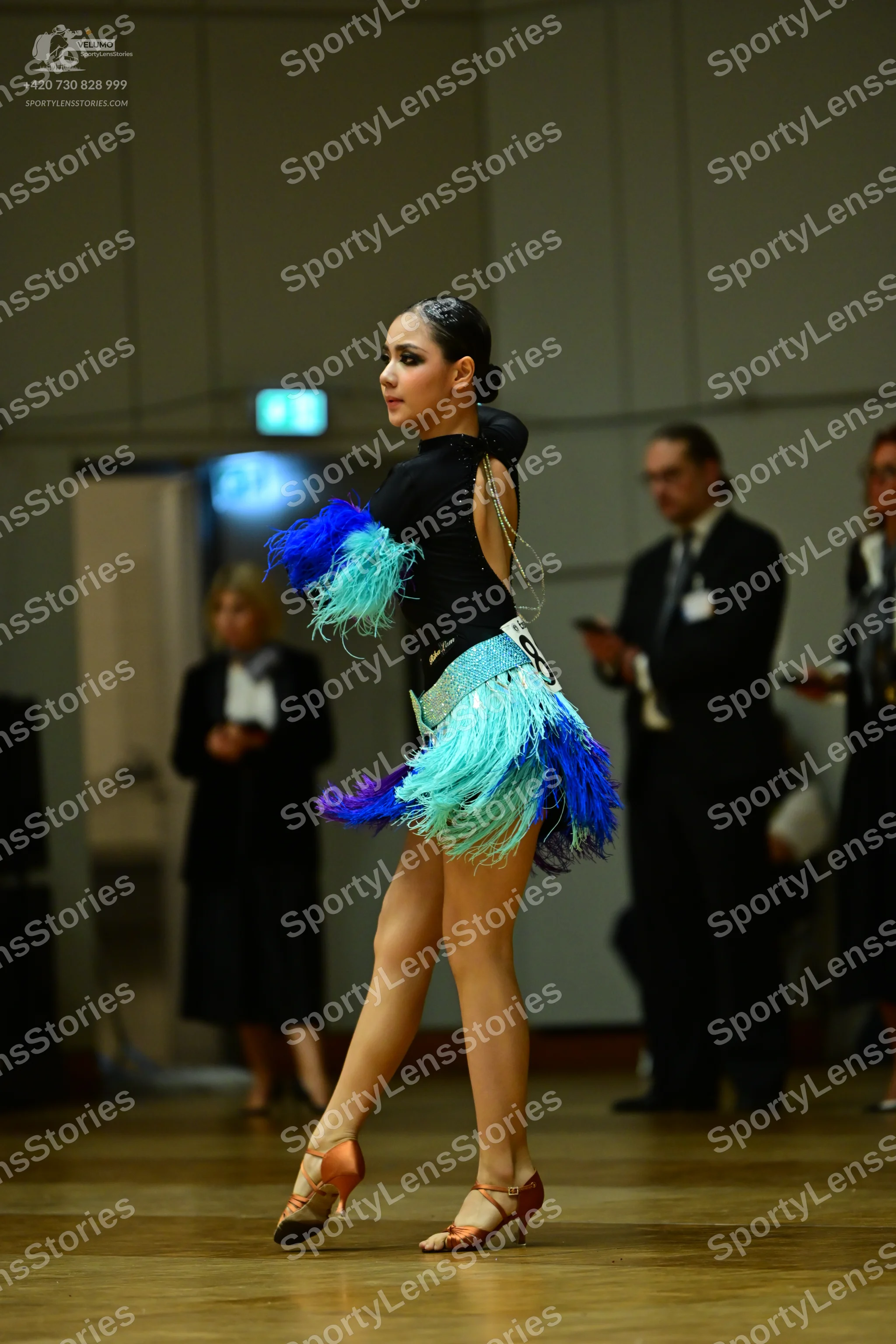 Dancesport competitor #88: Female dancer: black latin dance dress with a black bodice and a multi-colored f