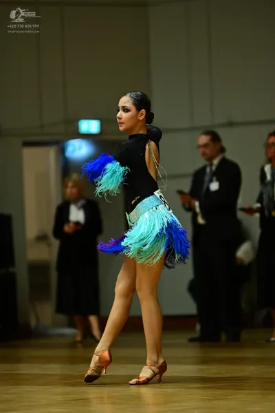 Dancesport competitor #88: Female dancer: black latin dance dress with a black bodice and a multi-colored f