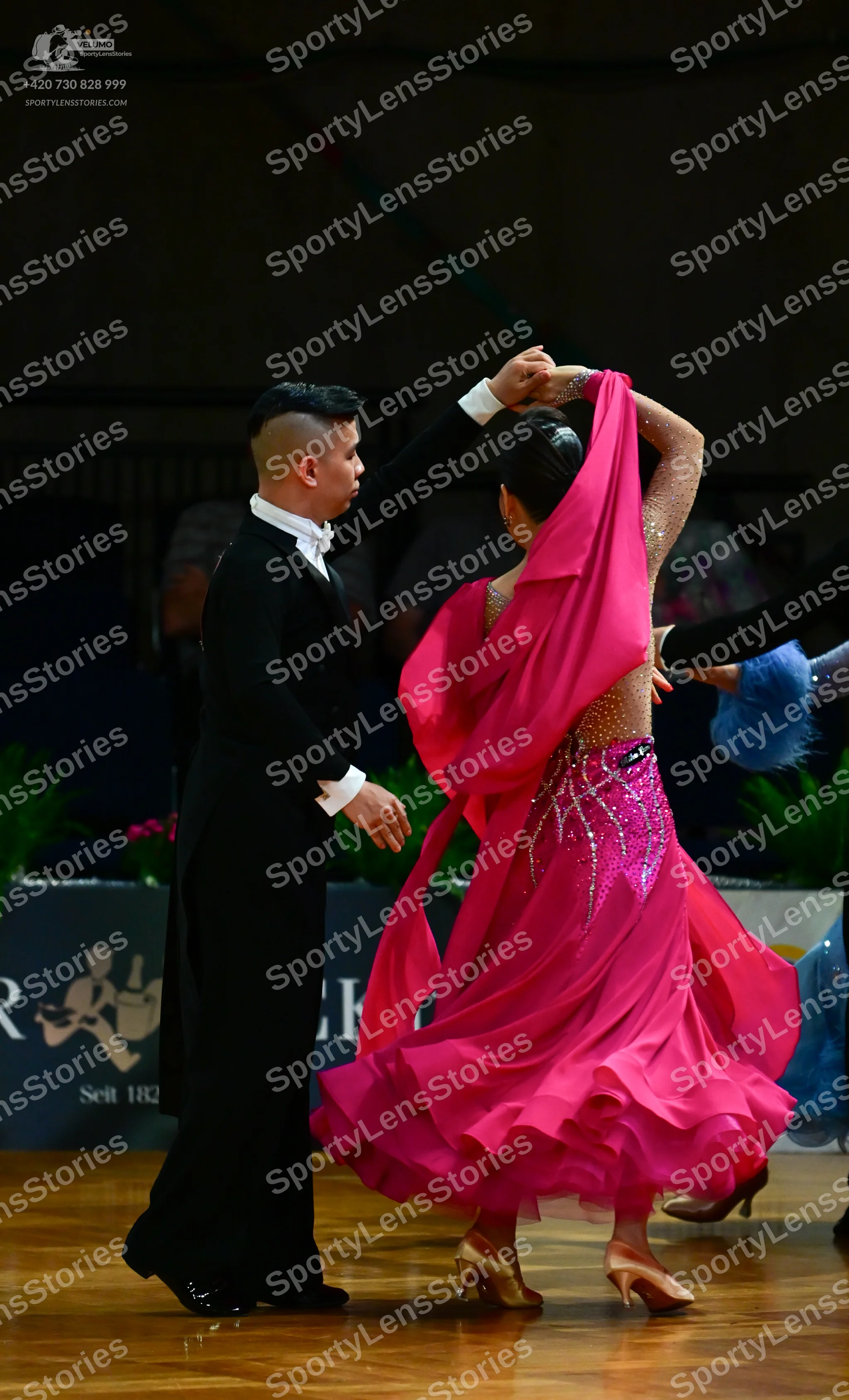 Dancesport competitor: Male dancer: black suit with a white shirt