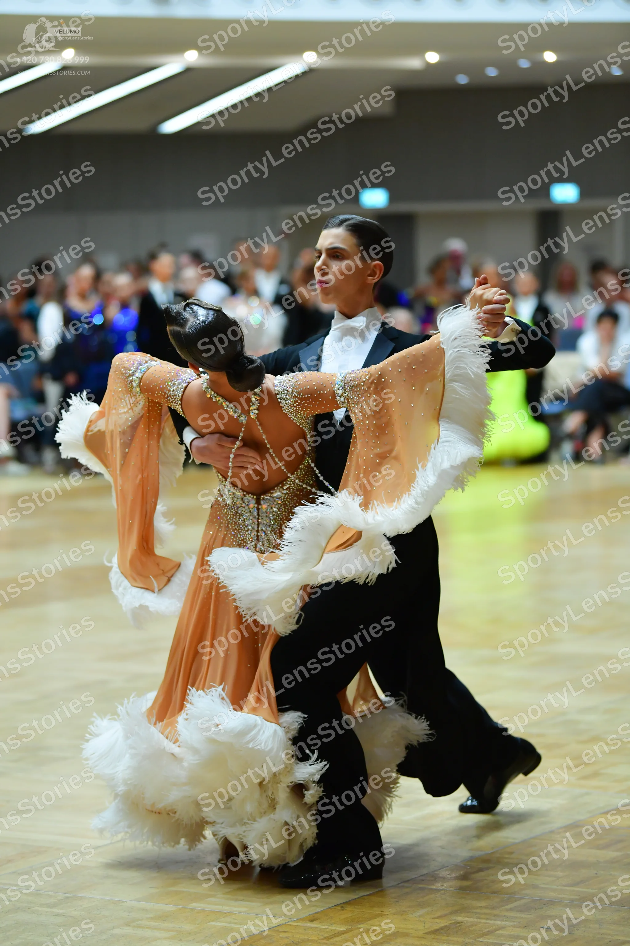 Dancesport competitor: Male dancer: black suit with white shirt and white bow tie