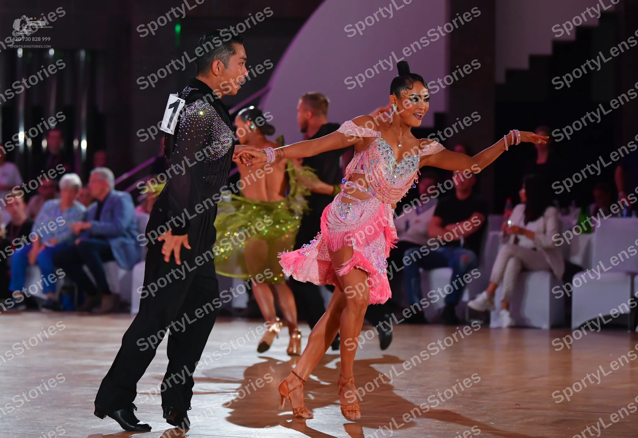 Dancesport competitor: Male dancer: black long-sleeved shirt with sequins on the sleeve and black trous