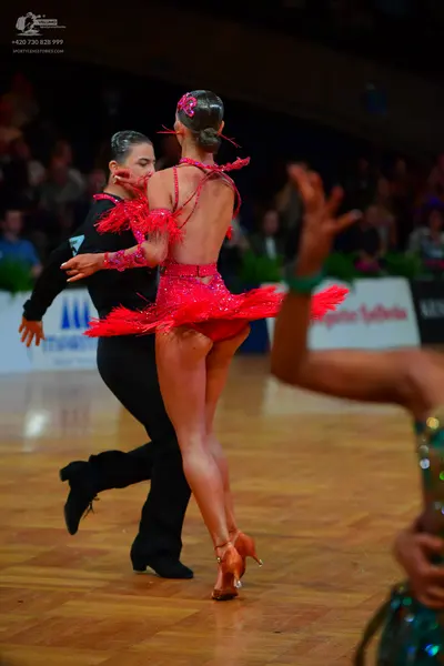 Dancesport competitor: Male dancer: black long-sleeved shirt and black trousers