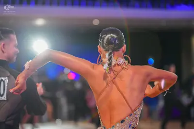 Dancesport competitor: Male dancer: black long-sleeved top