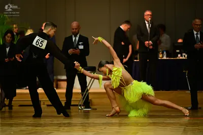 Dancesport competitor #65: Male dancer: black long-sleeved dance shirt and black trousers