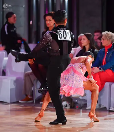 Dancesport competitor #601: Male dancer: black long-sleeved shirt with sequins on the upper back and black t