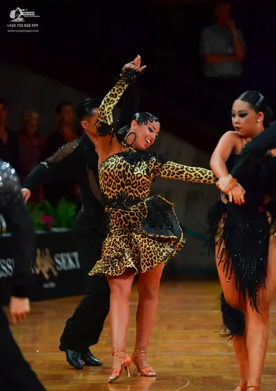 Dancesport competitor: Male dancer: black long-sleeved shirt with subtle sequins on the sleeve and blac