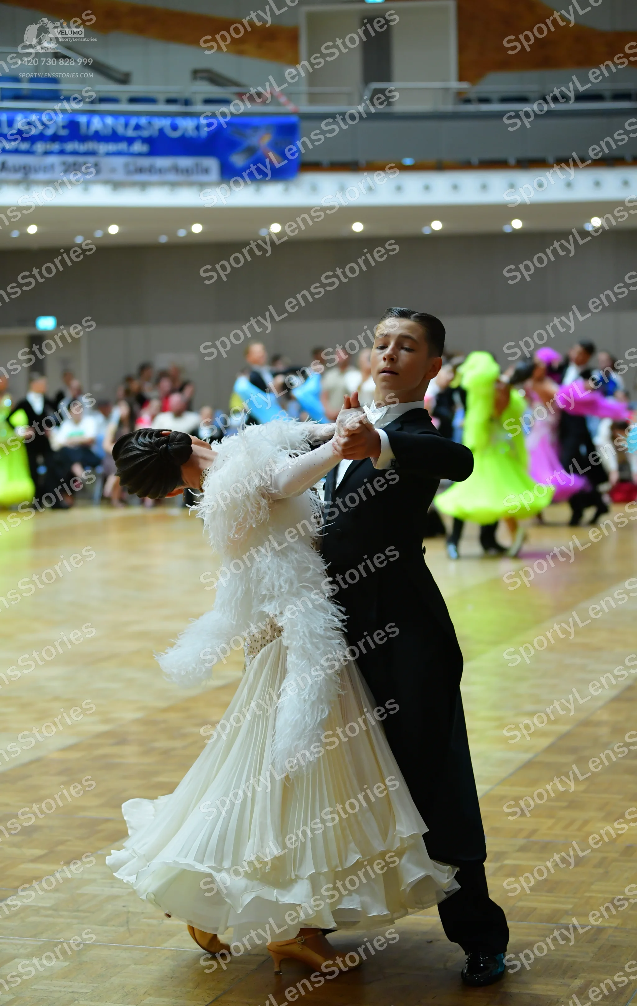 Dancesport competitor: Male dancer: black ballroom tailcoat with a white shirt and white bowtie