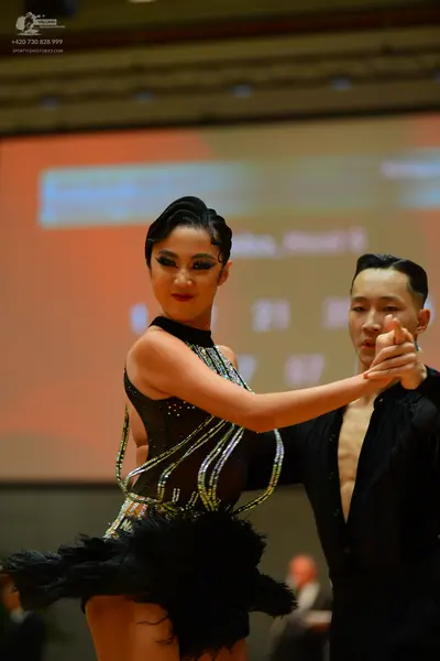 Dancesport competitor: Female dancer: black latin dance costume with silver sequin/rhinestone patterns 