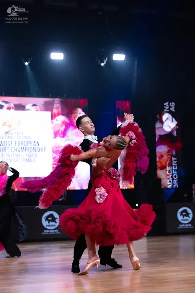 Dancesport competitor: Male dancer: black dance suit with a white shirt and black bowtie