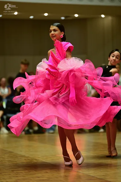 Dancesport competitor: Female Dancers**

*   **Dancer 1:** Color: Bright Pink