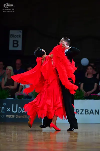 Dancesport competitor: Male dancer: black suit