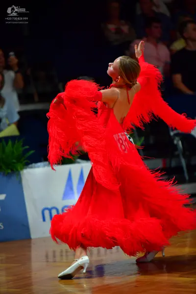 Dancesport competitor #88: Female dancer: red ballroom dress with long fringe on the sleeves and skirt