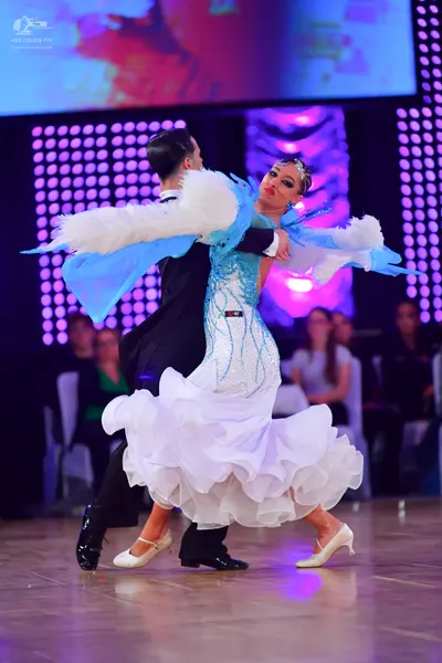 Dancesport competitor: Male dancer: black suit with black trousers and black dance shoes
