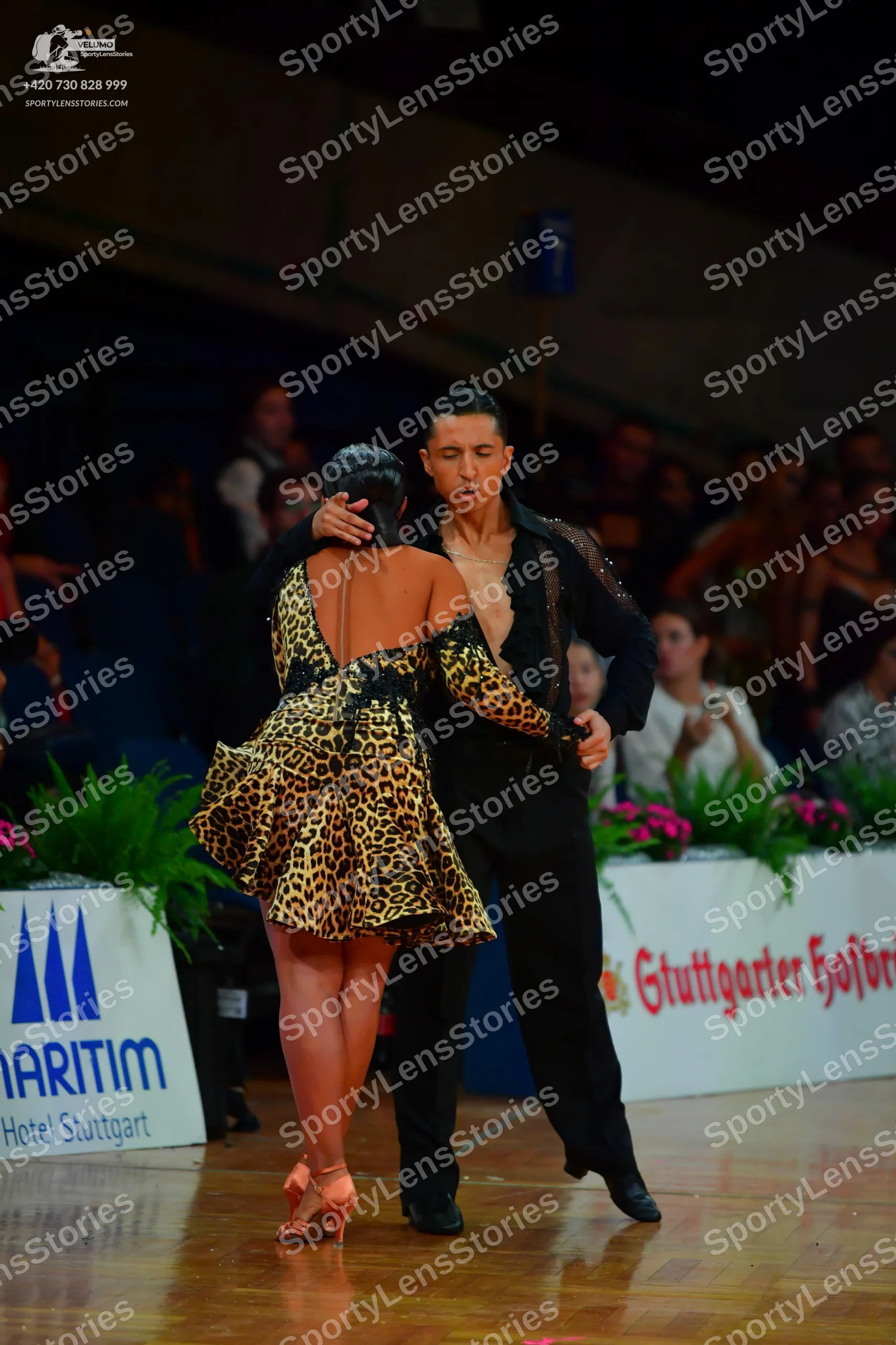 Dancesport competitor: Male dancer: black long-sleeved shirt with textured detailing and black trousers