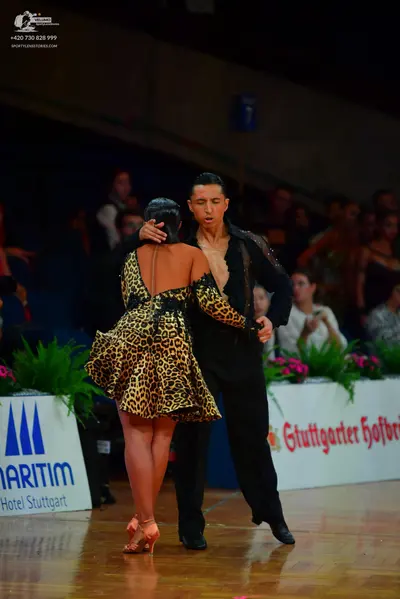 Dancesport competitor: Male dancer: black long-sleeved shirt with textured detailing and black trousers