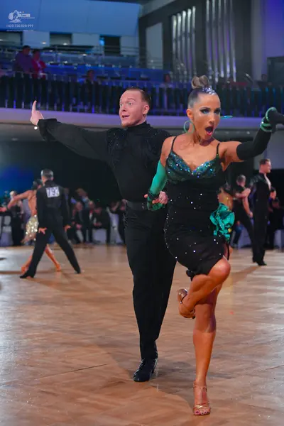 Dancesport competitor #73: Main male dancer: black long-sleeved shirt and black trousers