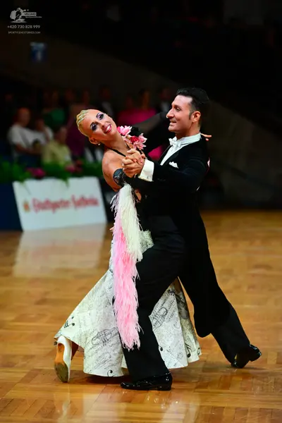 Dancesport competitor: Male dancer: black suit with white shirt and white bowtie