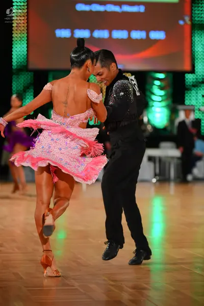 Dancesport competitor #61: Female dancer: pink Latin dress with sequins and fringe