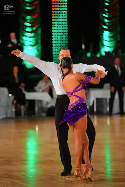 Dancesport competitor: Male dancer: white long-sleeved shirt and black trousers