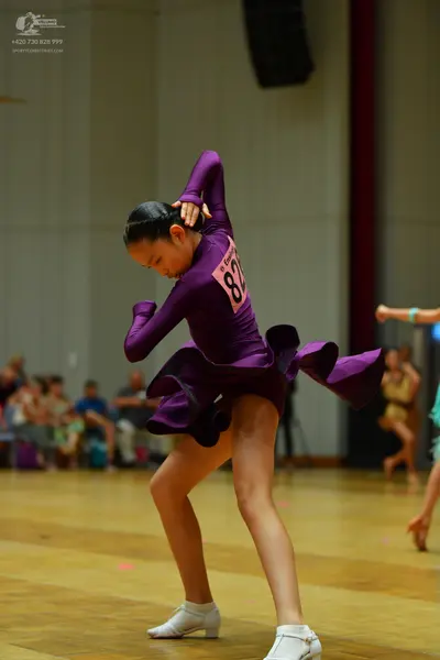Dancesport competitor #82: Female dancer: purple latin dress with a flared skirt