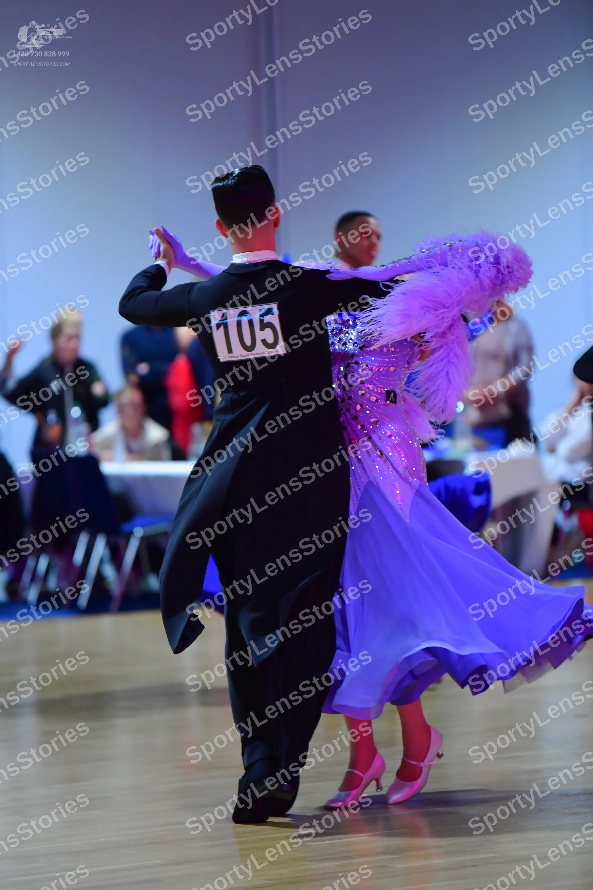 Dancesport competitor #105: Male dancer: black tailcoat, black trousers, and black dance shoes