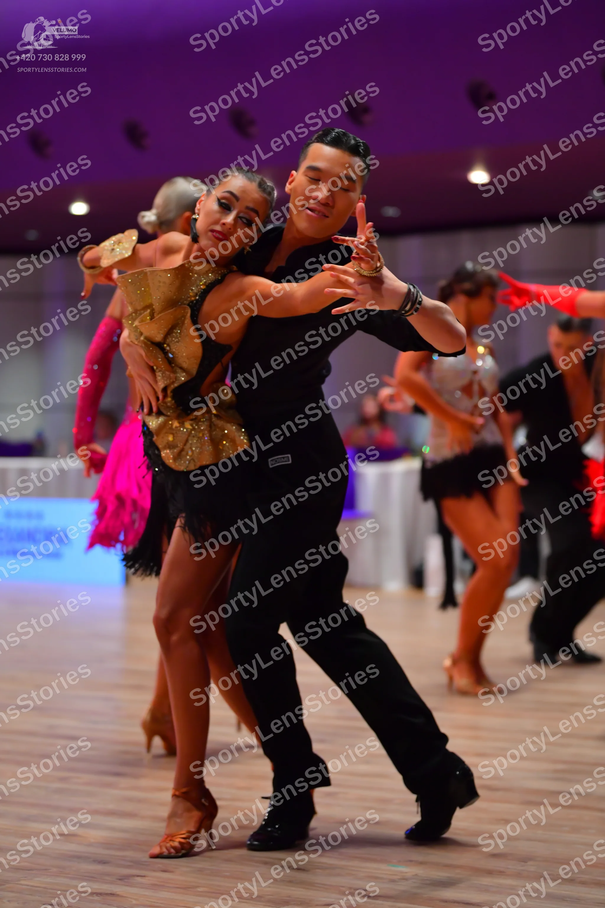 Dancesport competitor: Male dancer: black long-sleeved shirt and black trousers